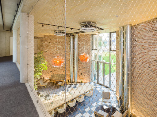 Flower Hotel Essen - Cable Mesh - Carl Stahl DecorCable Stainless steel cable mesh for safety and fall protection by Carl Stahl DecorCable at Flower Hotel Essen.